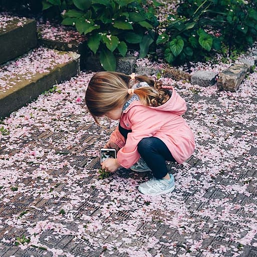 Girl playing with petals